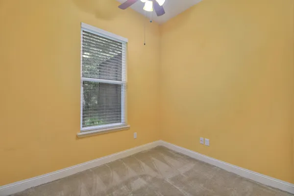 a view of a kitchen with a sink and a cabinet