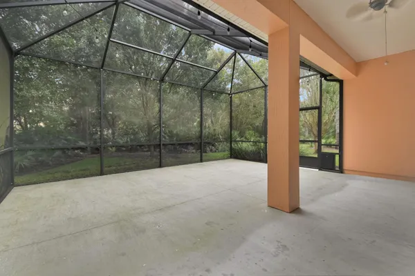 a view of an empty room with a balcony