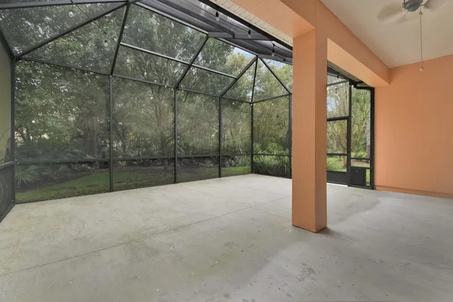 a view of an empty room with a balcony