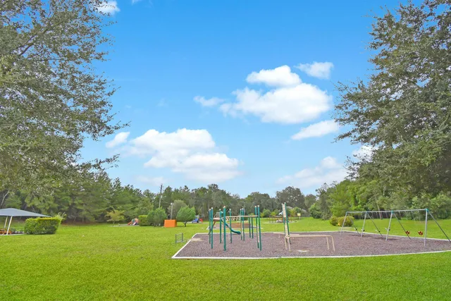 a view of a golf course with a lake view