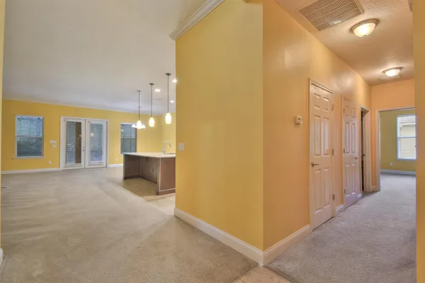 a view of a big room with a kitchen