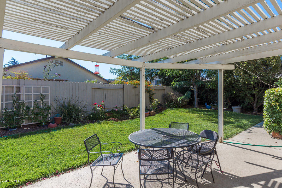 1616 Old Ranch Road Camarillo, CA 93012 - Photo 4 of 9 a view of a patio with a table chairs and a yard
