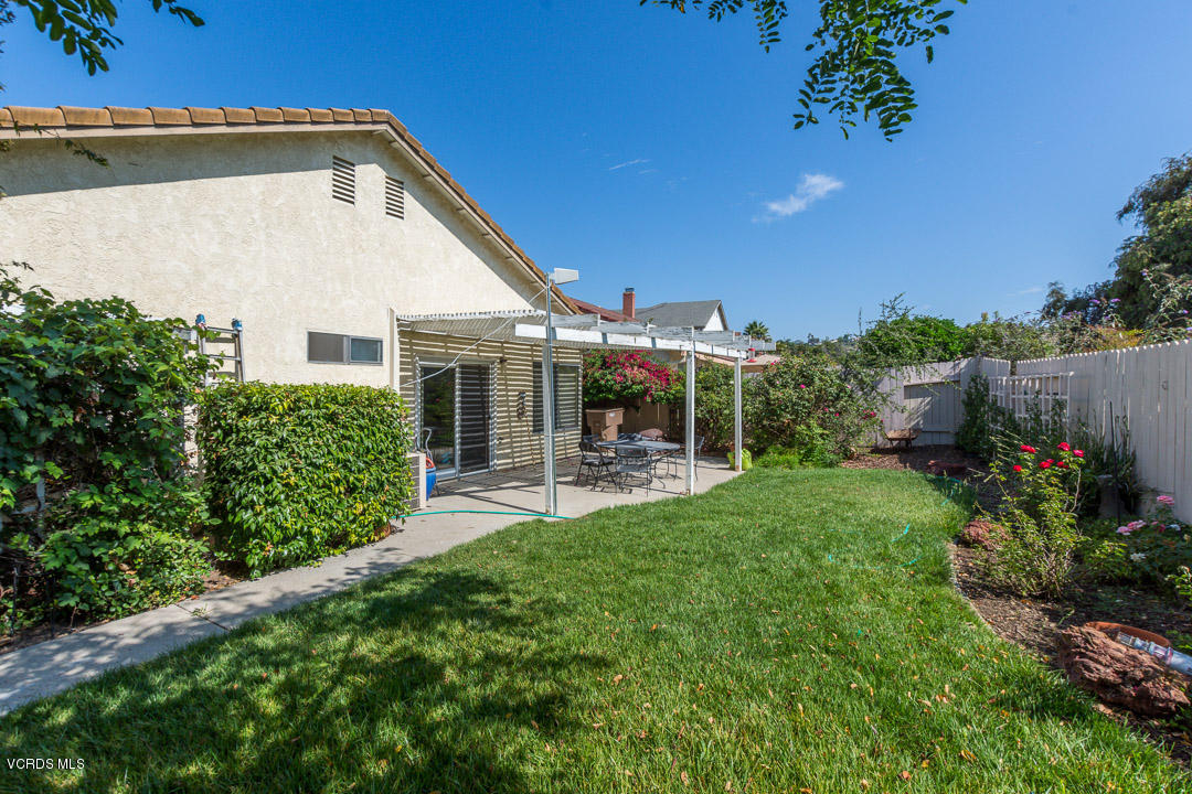 1616 Old Ranch Road Camarillo, CA 93012 - Photo 6 of 9 a backyard of a house with table and chairs plants and large tree