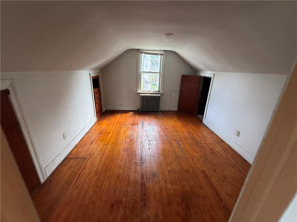 3051 Keystone Street Bethlehem, PA 18020 - Photo 15 of 18 A spacious attic retreat features a window and gleaming hardwood floors.