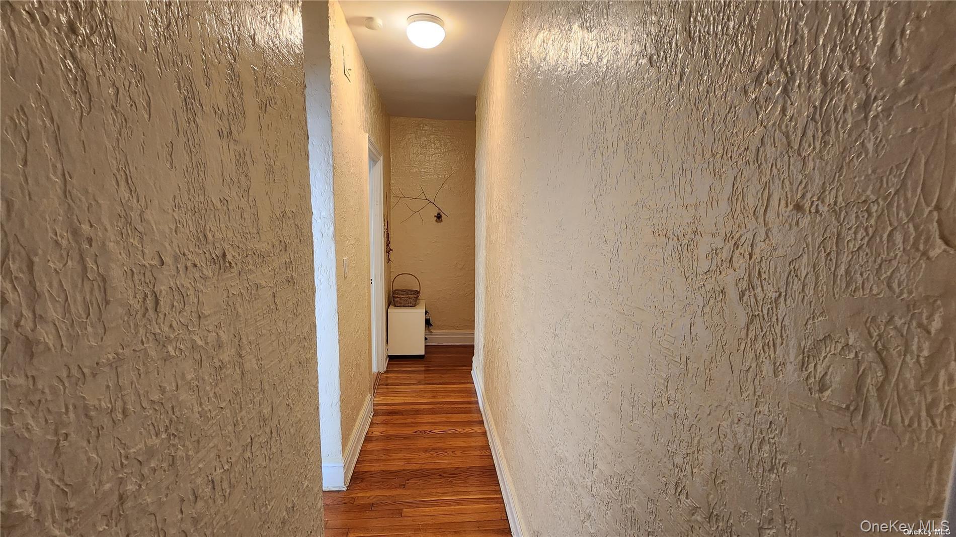 4 Maple Drive, Unit 6H Great Neck, NY 11021 - Photo 9 of 14 a view of a bathroom from the hallway