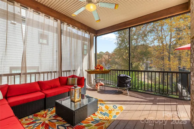 a living room filled with furniture and a potted plant
