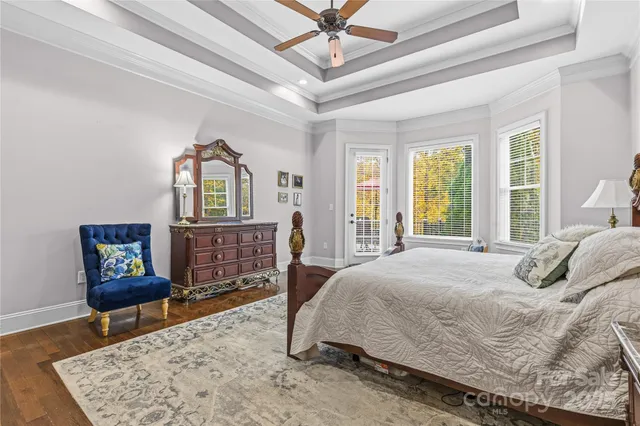 a large bathroom with a glass door shower and sink