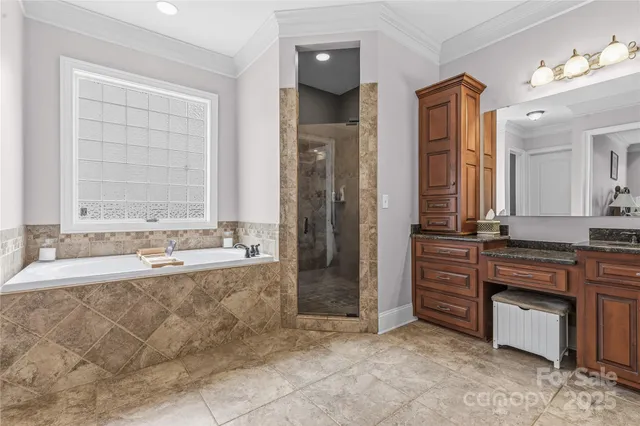 a spacious bathroom with a granite countertop sink and a mirror