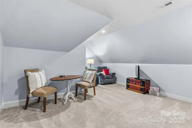 a large kitchen with stainless steel appliances granite countertop a refrigerator and a sink