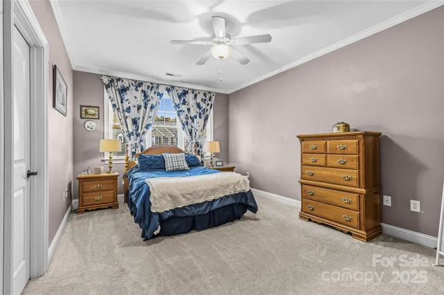 a spacious bedroom with a bed and cabinet