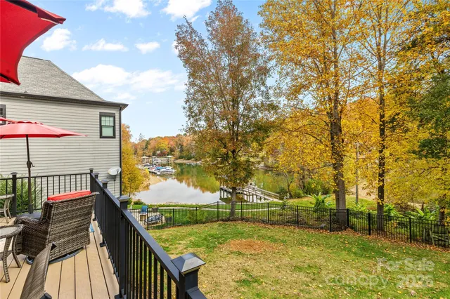 a living room with furniture windows and wooden floor