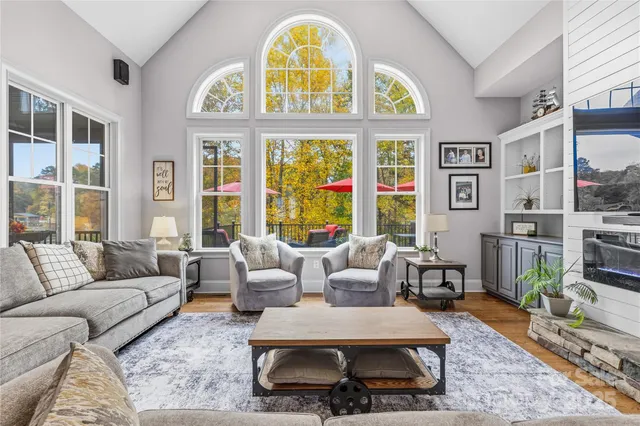 a view of a kitchen with granite countertop lots of counter top space and stainless steel appliances