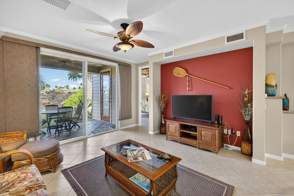 68-1122 Na Ala Hele Road, Unit H2 Kamuela, HI 96743 - Photo 3 of 12 a living room with furniture and a flat screen tv
