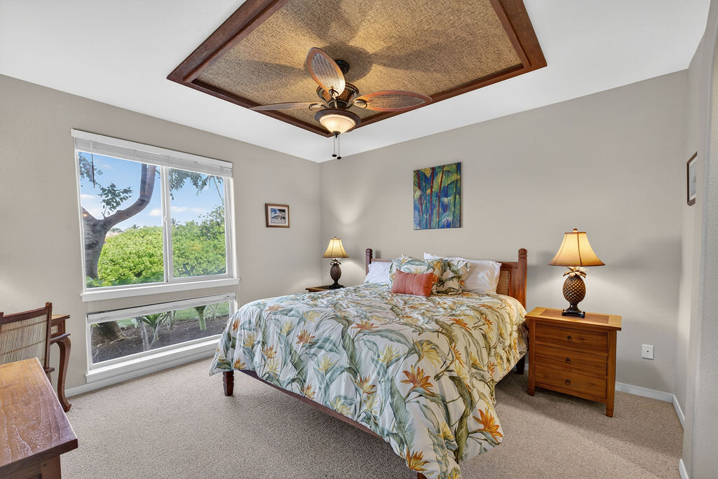 68-1122 Na Ala Hele Road, Unit H2 Kamuela, HI 96743 - Photo 5 of 12 a bedroom with a bed and a chandelier