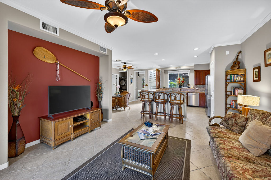 68-1122 Na Ala Hele Road, Unit H2 Kamuela, HI 96743 - Photo 7 of 12 a living room with furniture and a flat screen tv