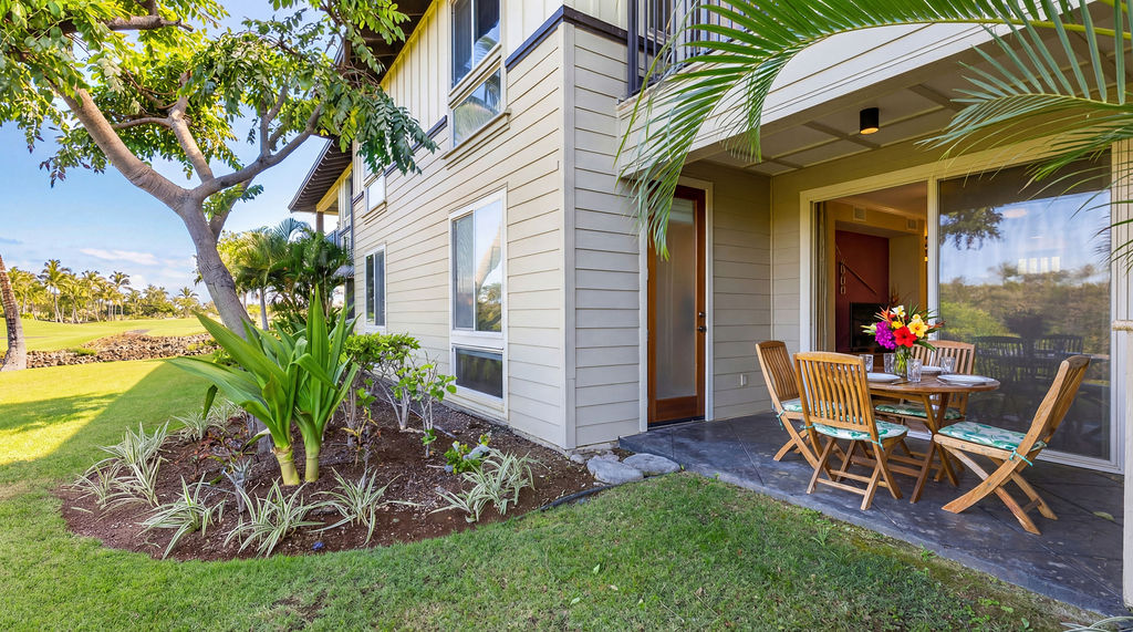 68-1122 Na Ala Hele Road, Unit H2 Kamuela, HI 96743 - Photo 8 of 12 a view of a chair and table in backyard of the house