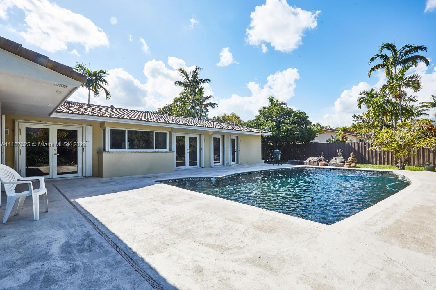 11103 Southwest 124th Road Miami, FL 33176 - Photo 21 of 23 front view of a house with a yard