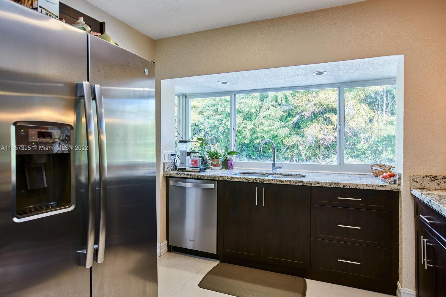 11103 Southwest 124th Road Miami, FL 33176 - Photo 8 of 23 a kitchen with a sink and large window