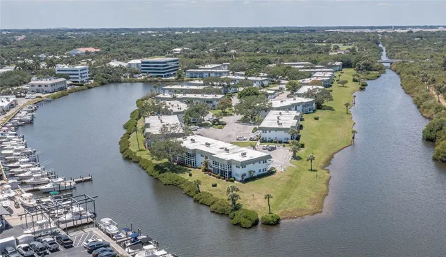 an aerial view of a house with a lake view