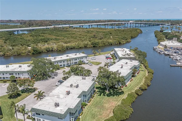 an aerial view of a house with a lake view