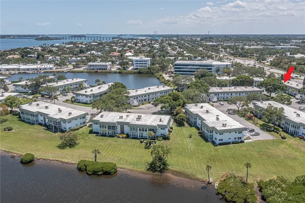 an aerial view of a houses with swimming pool