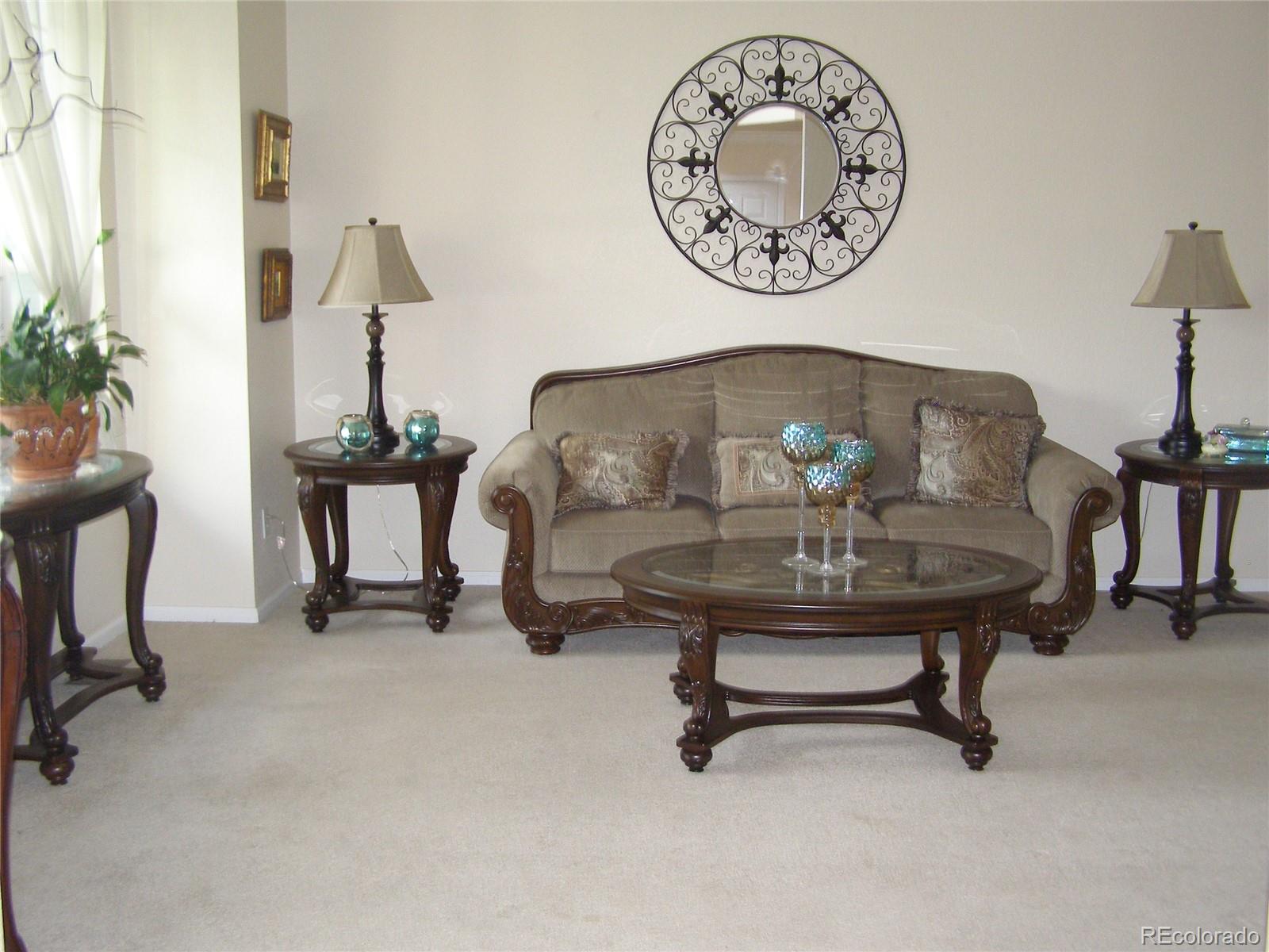 1730 Spring Water Place Highlands Ranch, CO 80129 - Photo 4 of 31 a view of a room with a table and a chair