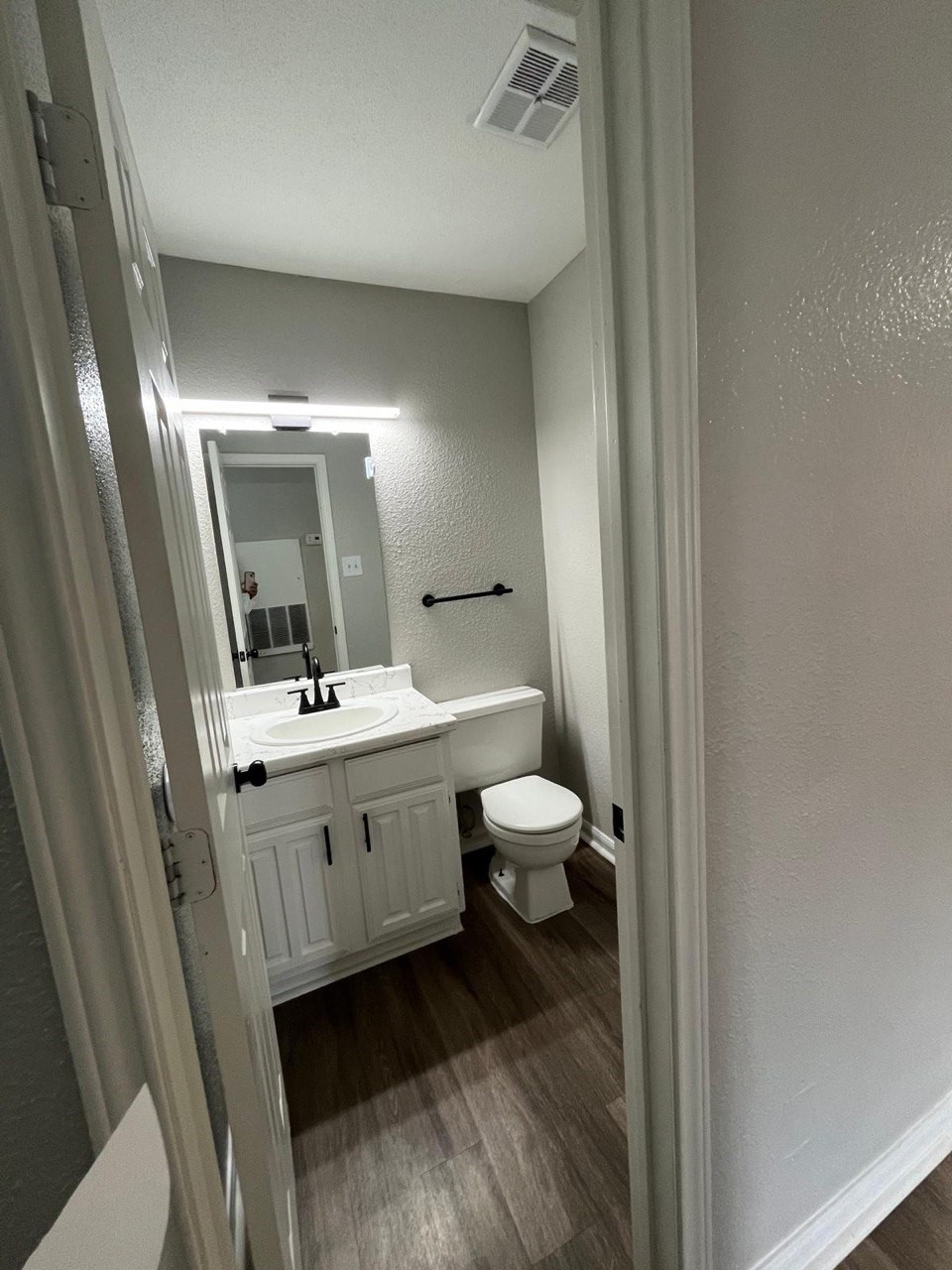 9255 West Sam Houston Parkway South, Unit 105 Houston, TX 77036 - Photo 5 of 13 a bathroom with a double vanity sink and a mirror