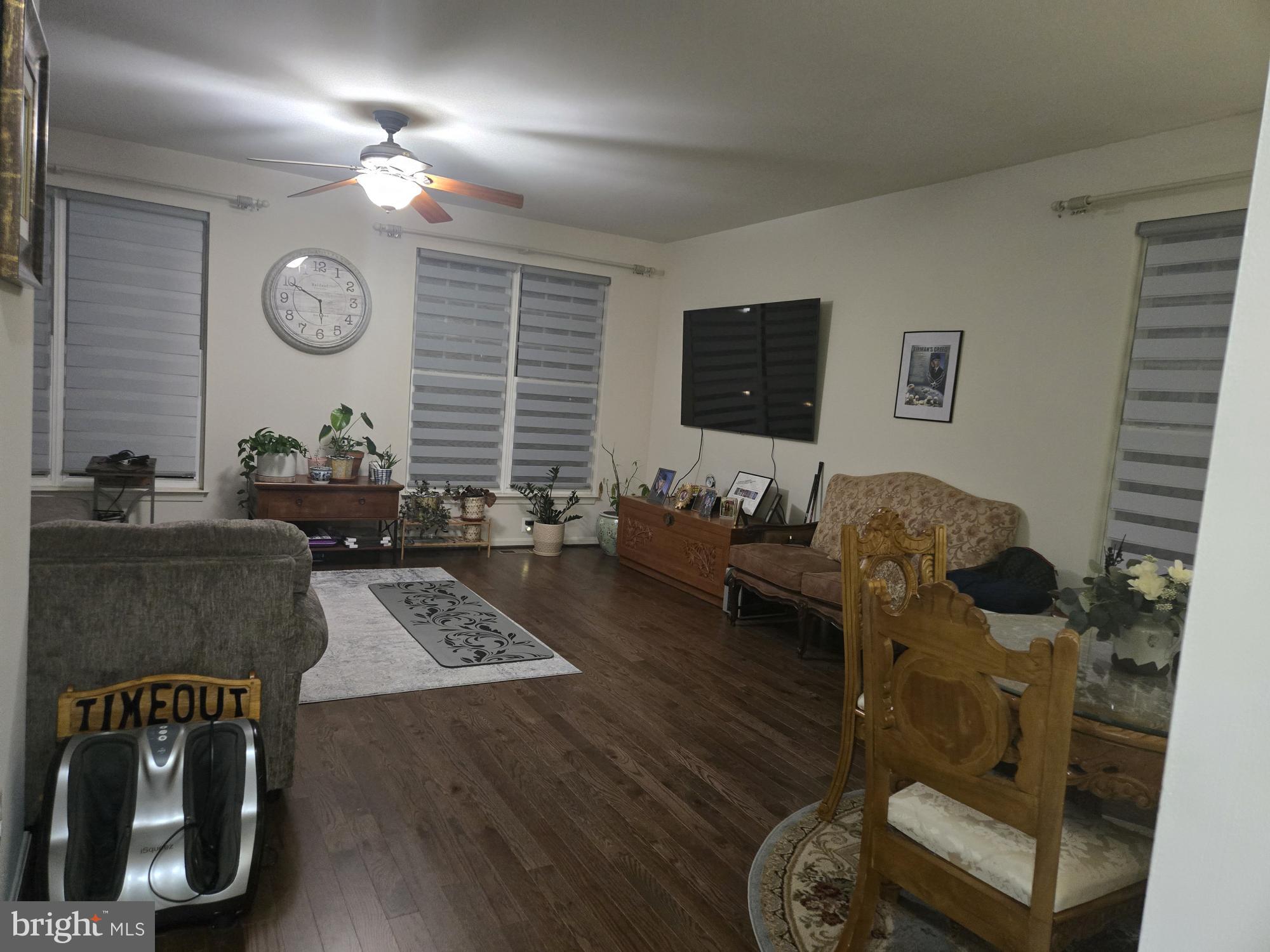 9254 Cascade Falls Drive Bristow, VA 20136 - Photo 2 of 14 a living room with furniture and a flat screen tv
