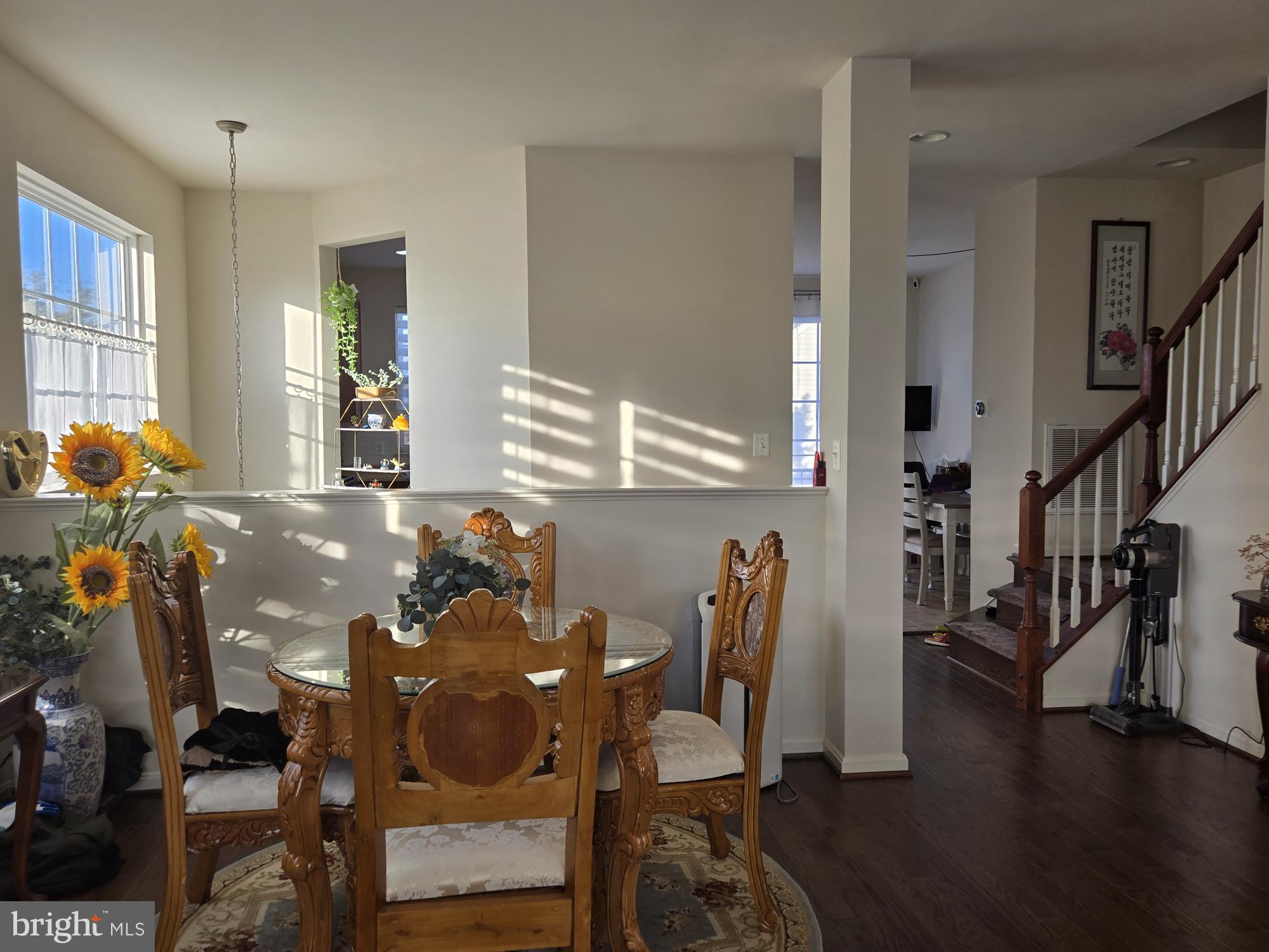 9254 Cascade Falls Drive Bristow, VA 20136 - Photo 7 of 14 a view of a dining room with furniture and wooden floor