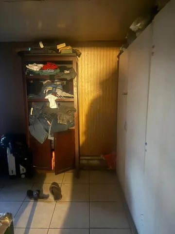 a room that has a bed and a table in it