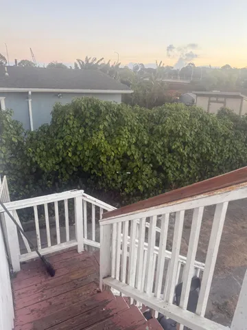 a view of a wooden deck and city view