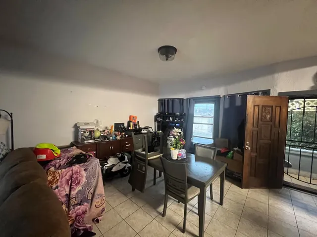 a bed room with furniture and a window