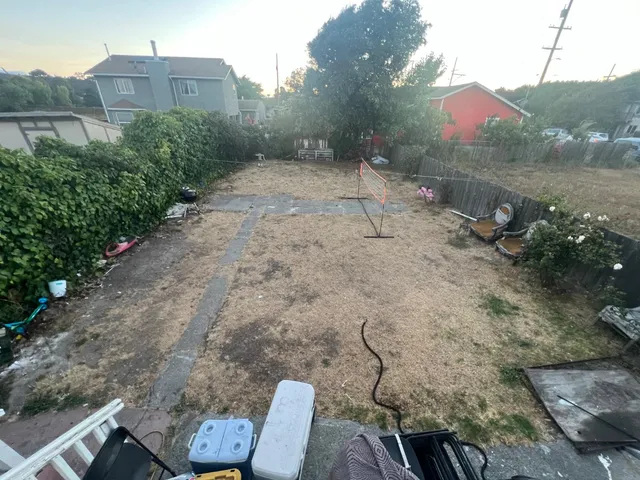 a view of a chairs in a backyard