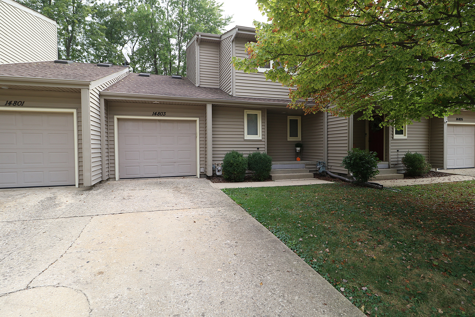 14803 South Penn Road Plainfield, IL 60544 - Photo 1 of 17 a front view of a house with a yard and garage