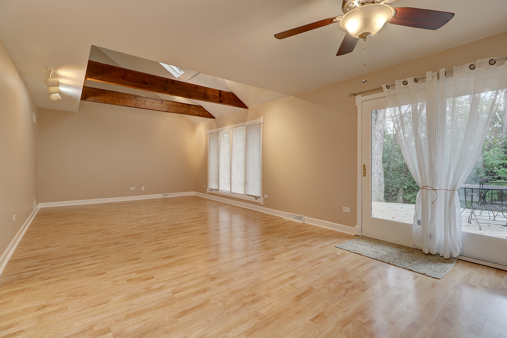14803 South Penn Road Plainfield, IL 60544 - Photo 2 of 17 a view of an empty room with wooden floor and a window