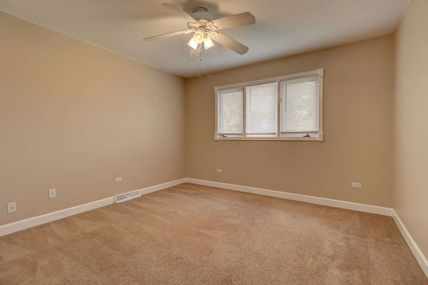14803 South Penn Road Plainfield, IL 60544 - Photo 11 of 17 a view of an empty room with a window