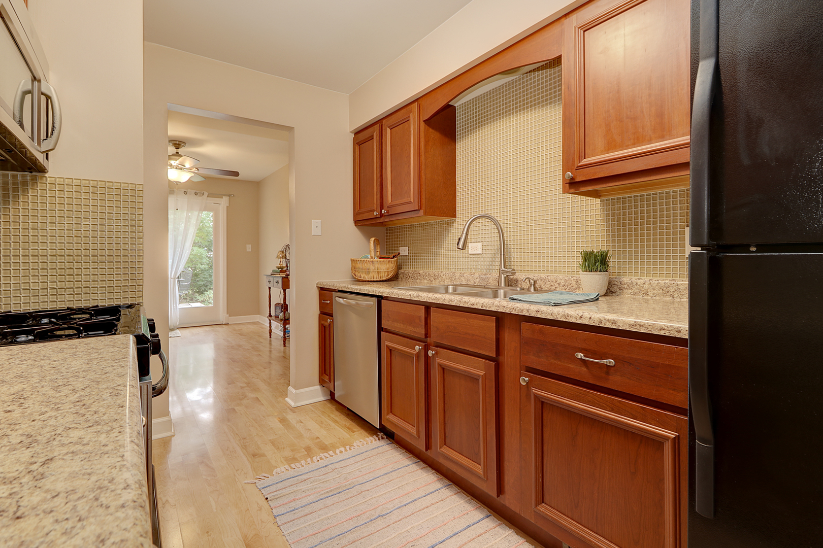 14803 South Penn Road Plainfield, IL 60544 - Photo 6 of 17 a spacious bathroom with a granite countertop sink and a mirror