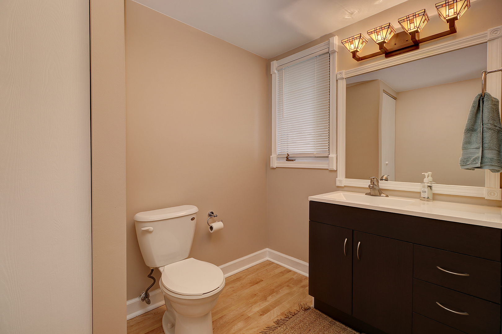 14803 South Penn Road Plainfield, IL 60544 - Photo 9 of 17 a bathroom with a toilet a sink and mirror
