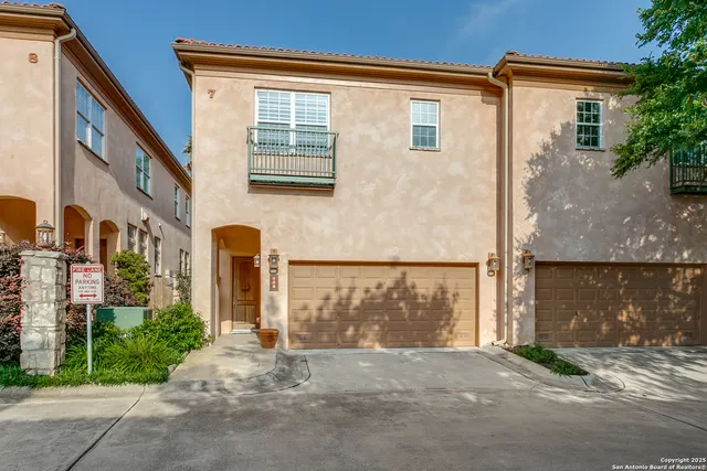 a view of a house with a street
