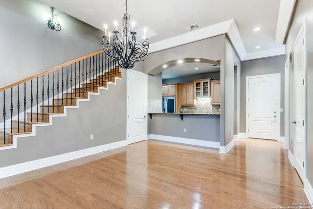 a view of a kitchen with kitchen island wooden floor and window