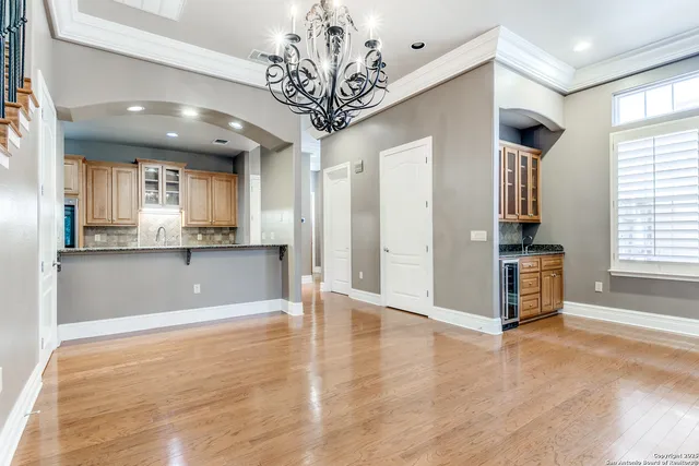 a kitchen with granite countertop a stove and a sink