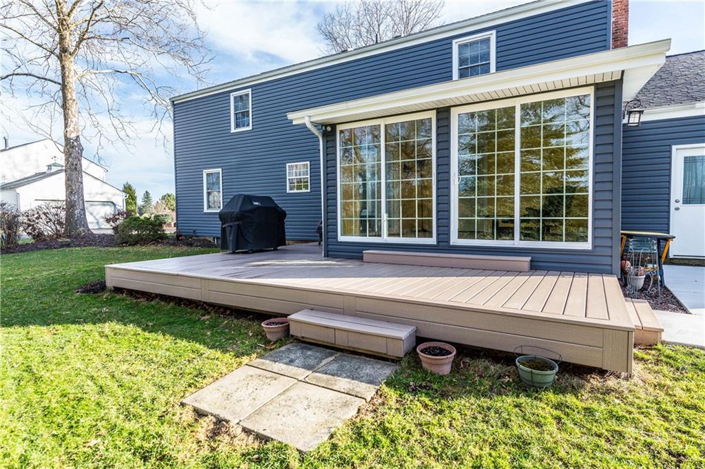 230 Ridgeview Drive Wexford, PA 15090 - Photo 23 of 25 Back of house which shows the view of the 3 Season Room with a new Trex Deck .Access Door to right leading into Garages . Lots of outside space for Grilling and Entertaining......Gorgeous new Vinyl Siding.
