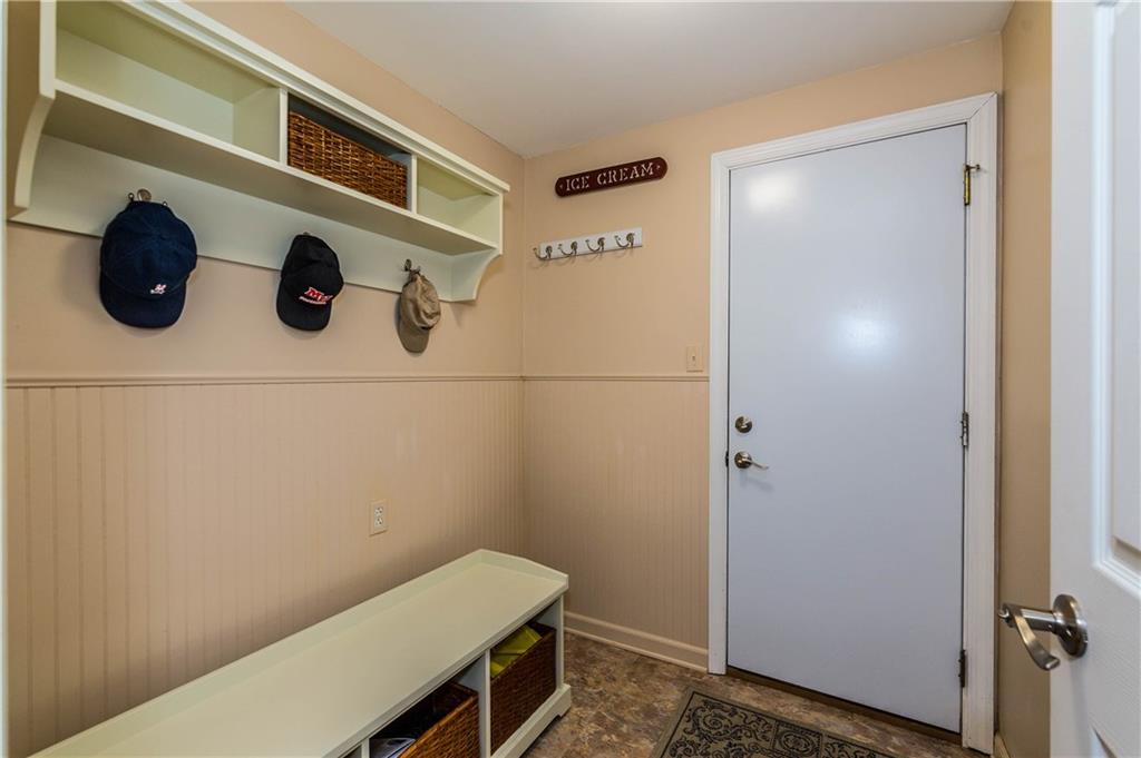 Mud Room.. Entry from the Garage leading into the Kitchen. This was the First Floor Laundry room which current owners moved to basement , but can easily be converted back to first floor level.. Gas and water line is still accessible for an easy convert if new buyers prefer. 