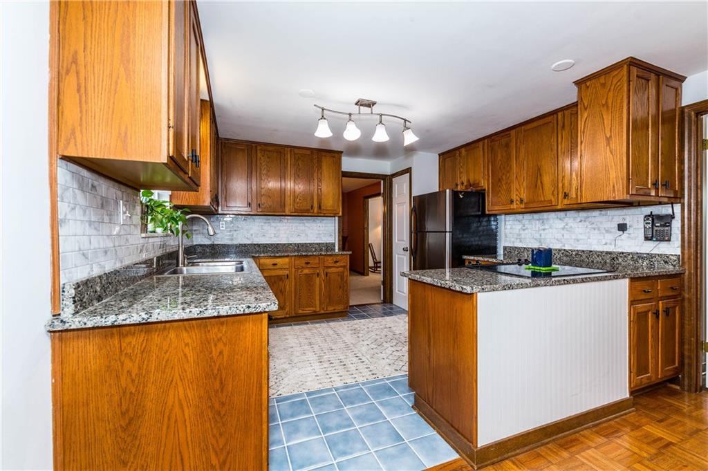Kitchen area,, ceramic tile floor, Granite Countertops, SS appliances , New lighting. 