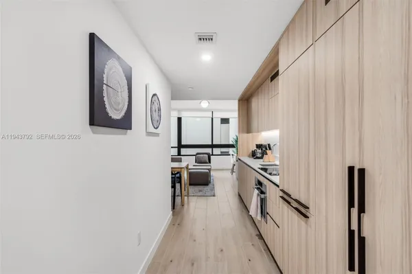 a view of a hallway with washer and dryer