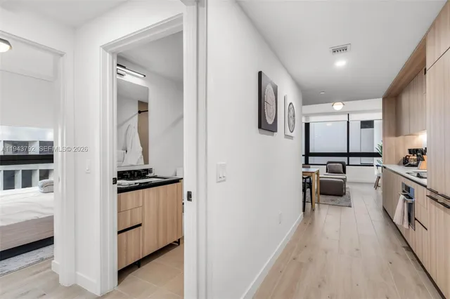 a kitchen with granite countertop a stove top oven and sink