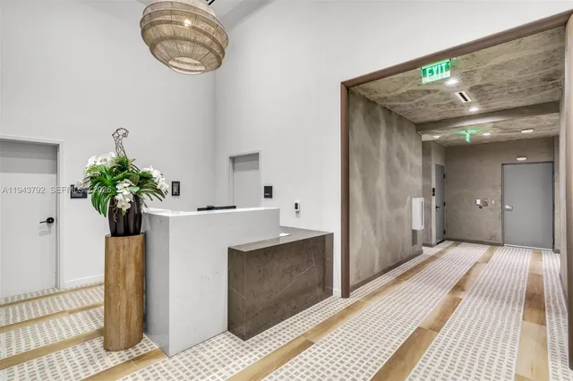 a view of a room with gym equipment and a cabinet