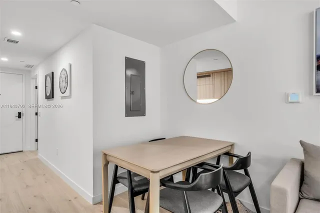 a view of a livingroom with furniture and wooden floor