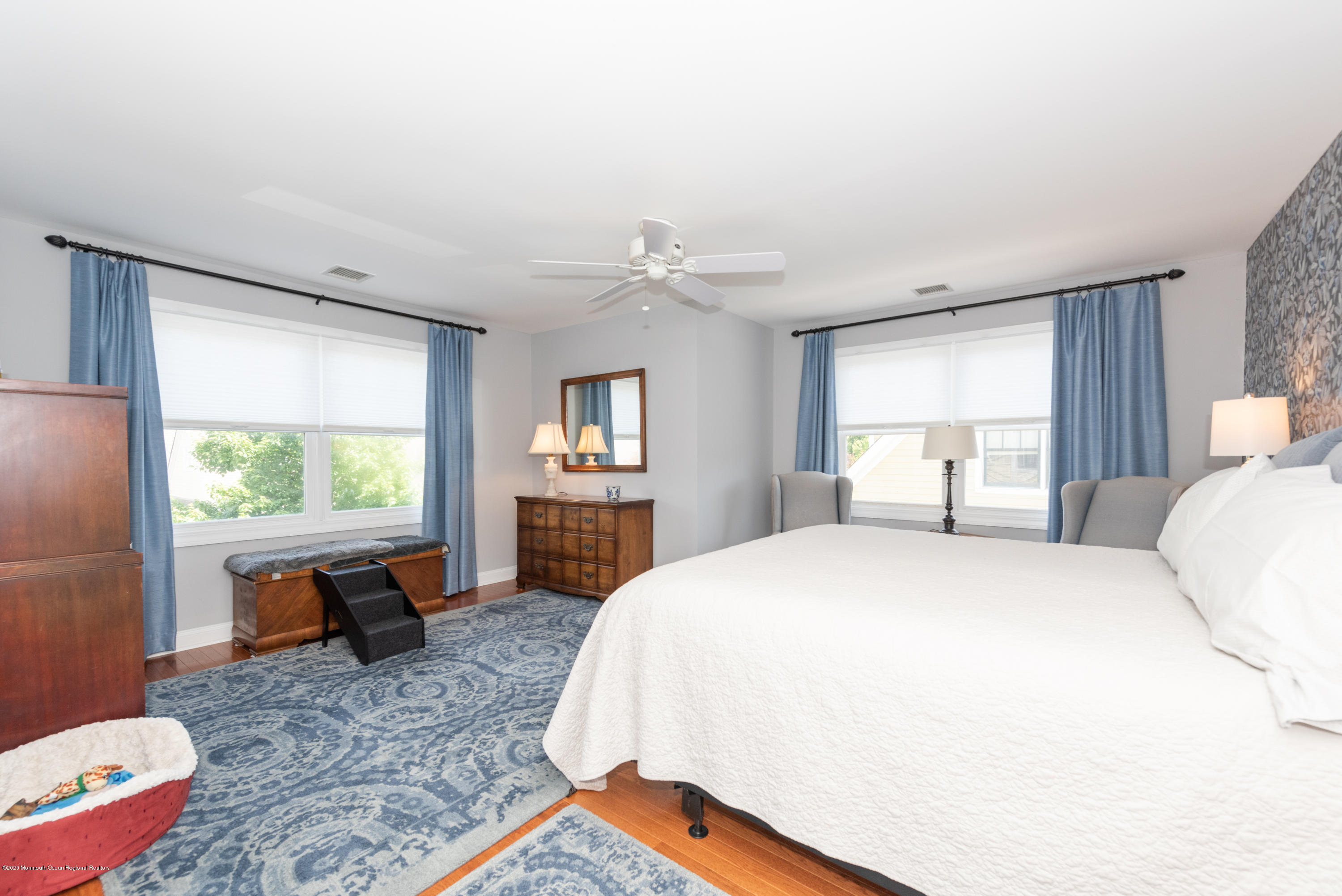 10 Adams Way Shrewsbury, NJ 07702 - Photo 14 of 19 a spacious bedroom with a bed and a dresser next to a window