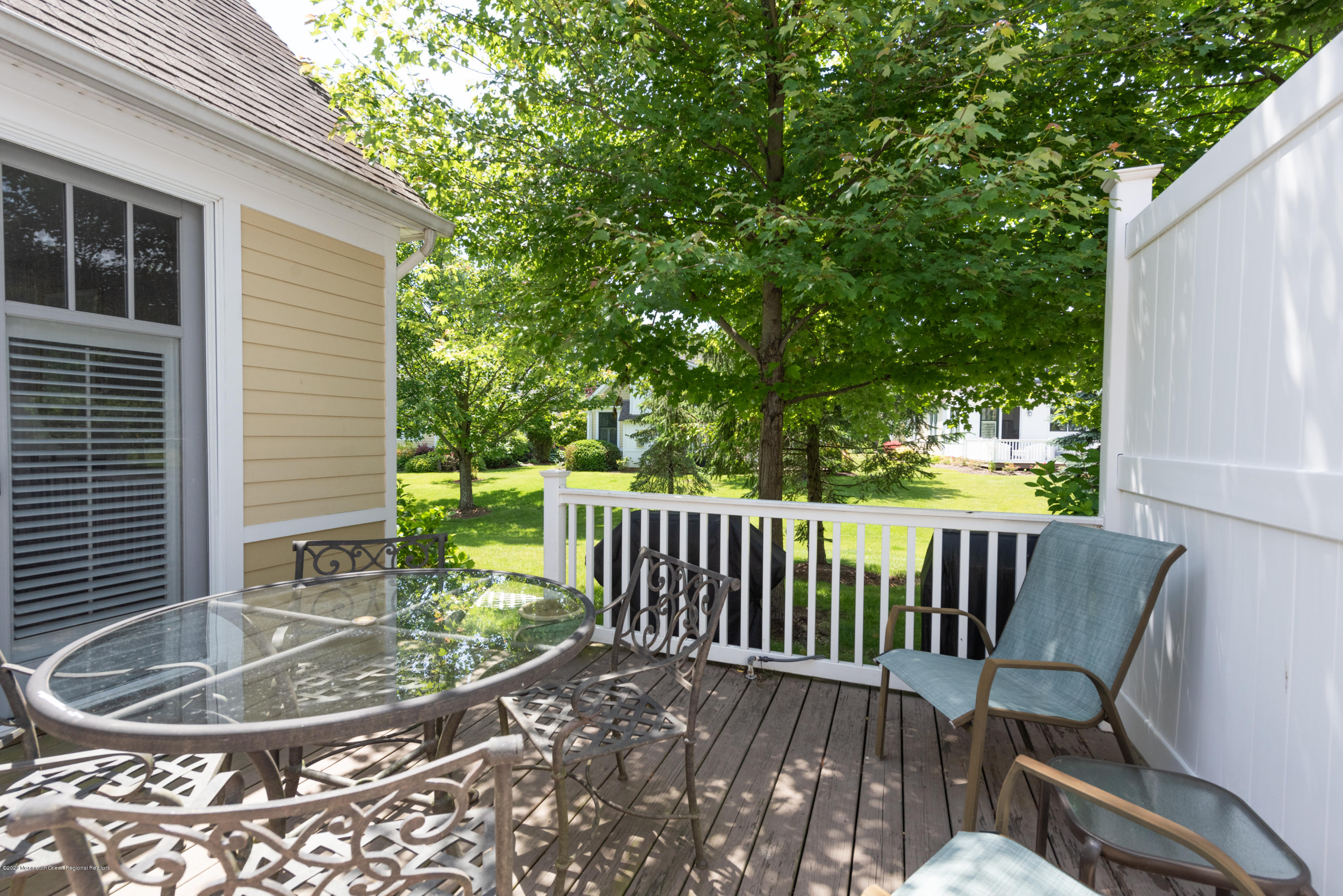 10 Adams Way Shrewsbury, NJ 07702 - Photo 16 of 19 a view of a chair and table in the patio
